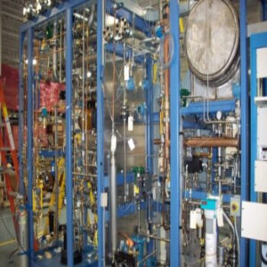 Industrial process automation skid with integrated control panel, piping, and instrumentation for manufacturing applications.